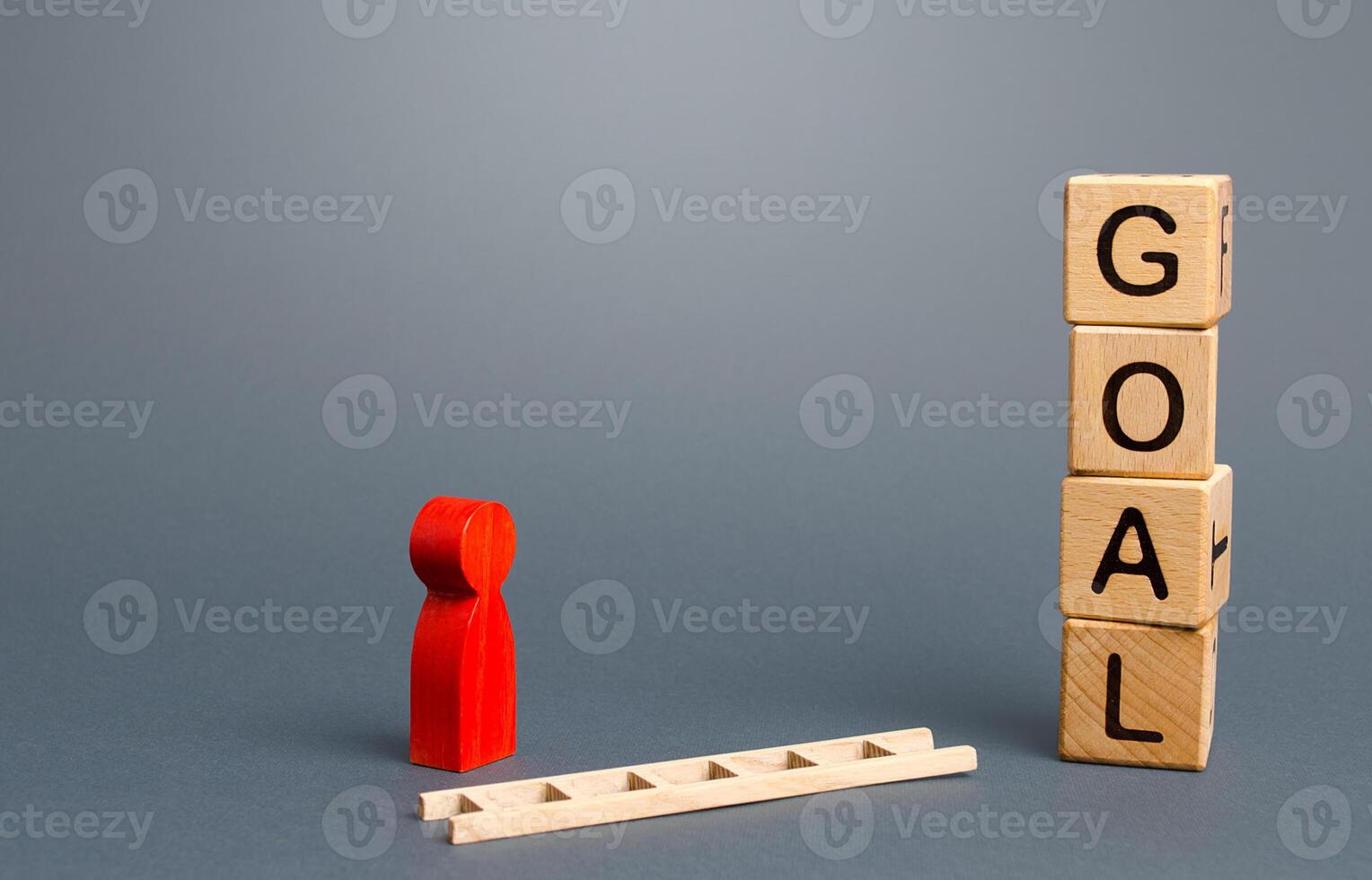 Person near Goal blocks tower and a fallen ladder. Using tools to solve problems, achieve success. Developing strategy. Attracting investment and financial resources for a successful business startup. photo