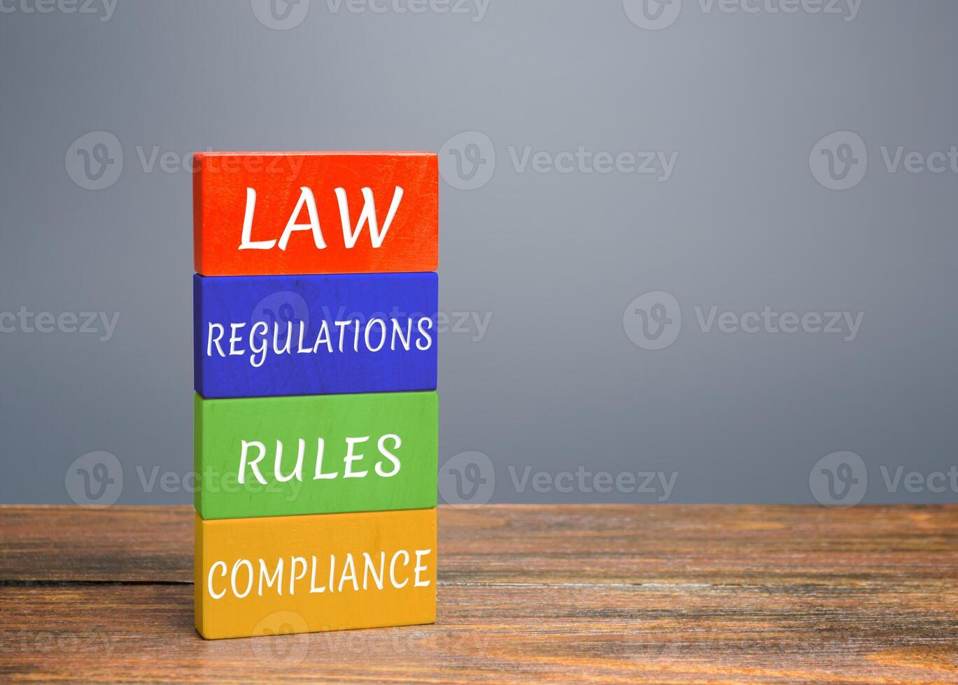 Colored blocks with words law, regulations, rules, compliance. Ease doing business. Quality criteria for goods, services. Protection national domestic producers manufacturers from strong competition photo