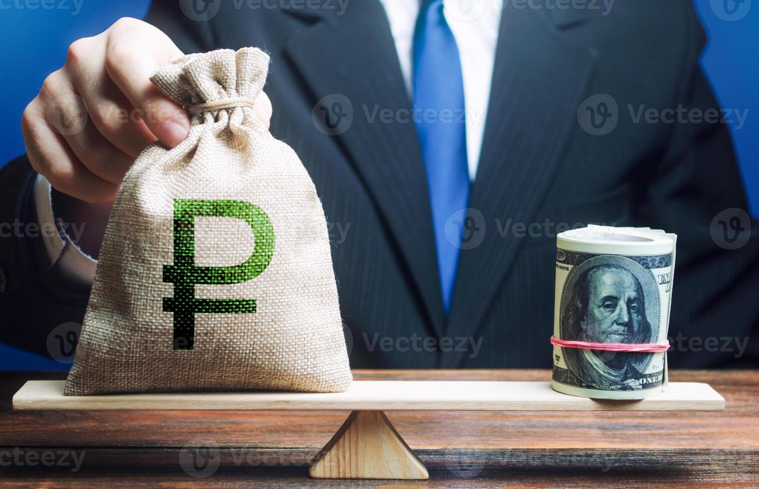 Man puts a russian ruble money bag on scales opposite to dollar bundle. Monetary policy. Central Bank Regulator. Market fluctuations. Exchange rate, comparison economic indicators. Avoiding inflation. photo
