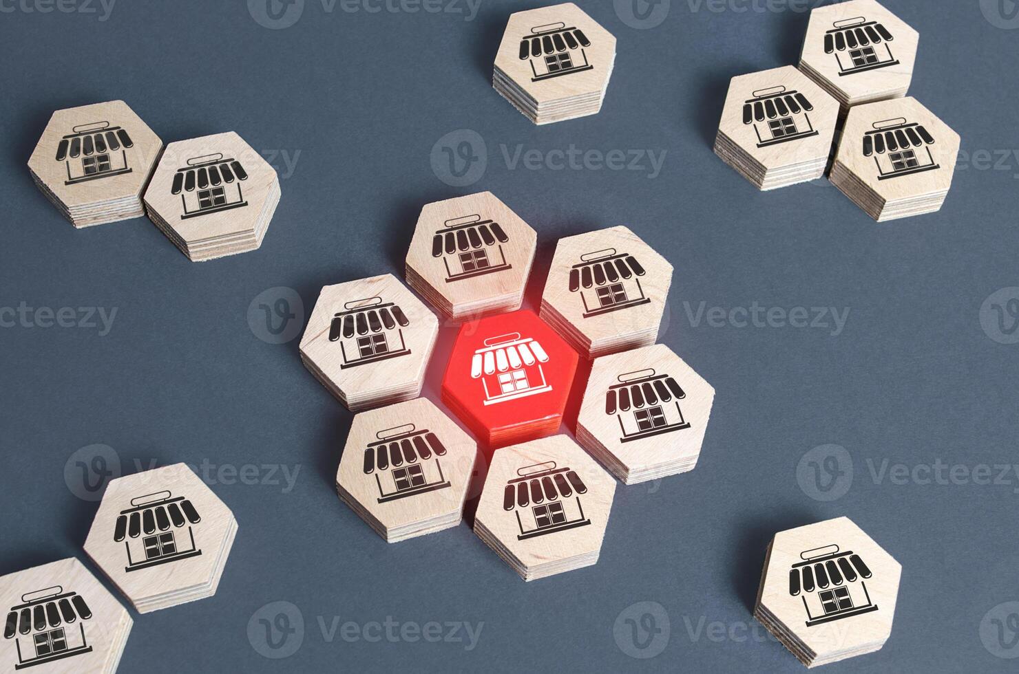 Figures with store symbols are combined into an assembly. Franchise commercial concession concept. Investing in asuccessful business model. Building a business empire. Expansion and competitive growth photo