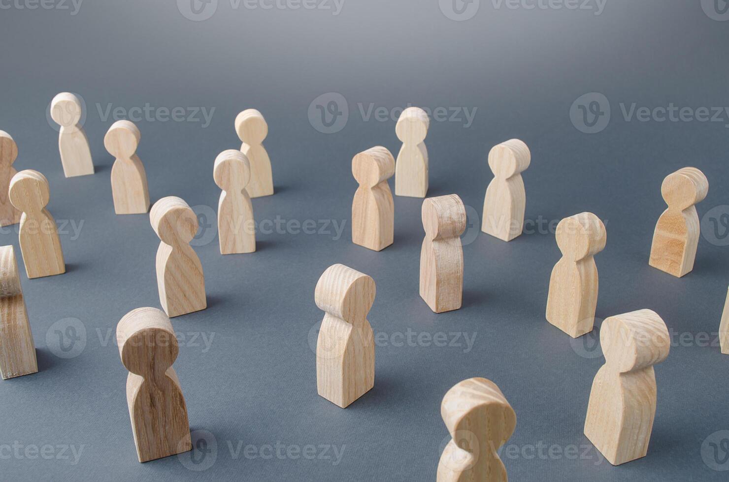 Many figures of people stand at a distance. People Society Concept. Behavior and social science relationships. Manipulation and management. Marketing, segmentation, consumer market research. photo