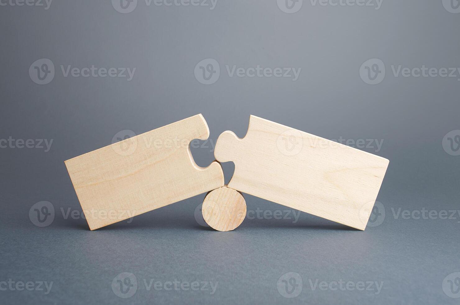 Two disassembled puzzles. Stop of work process and destruction of integrity due to obstacles or circumstances. Failure, inability to correct situation. Problem solving, finding the cause. Concept photo