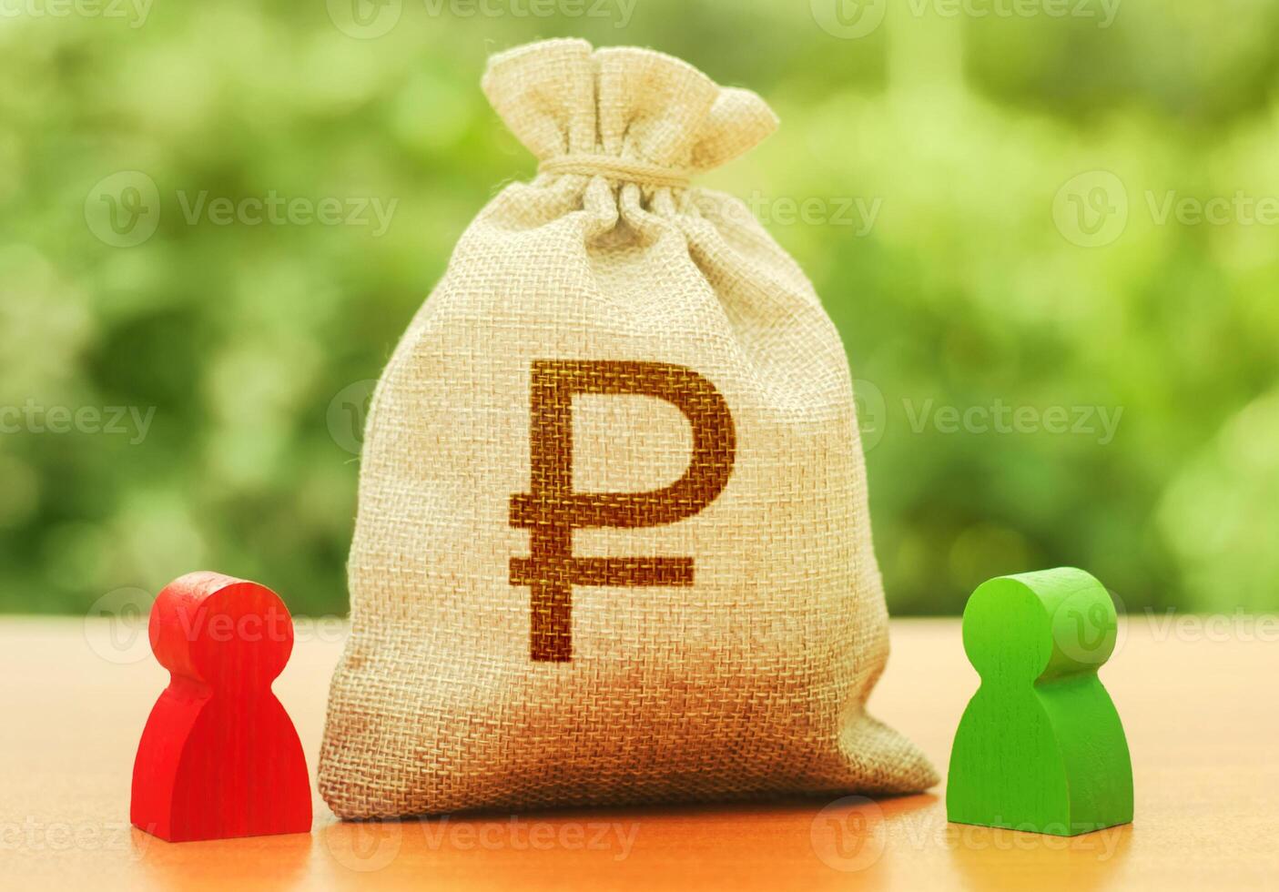 Russian ruble money bag and two people figures. Business Investment and lending, leasing. Dispute solution between two businessmen. Division of property. Business relationship. Trade agreement deal photo