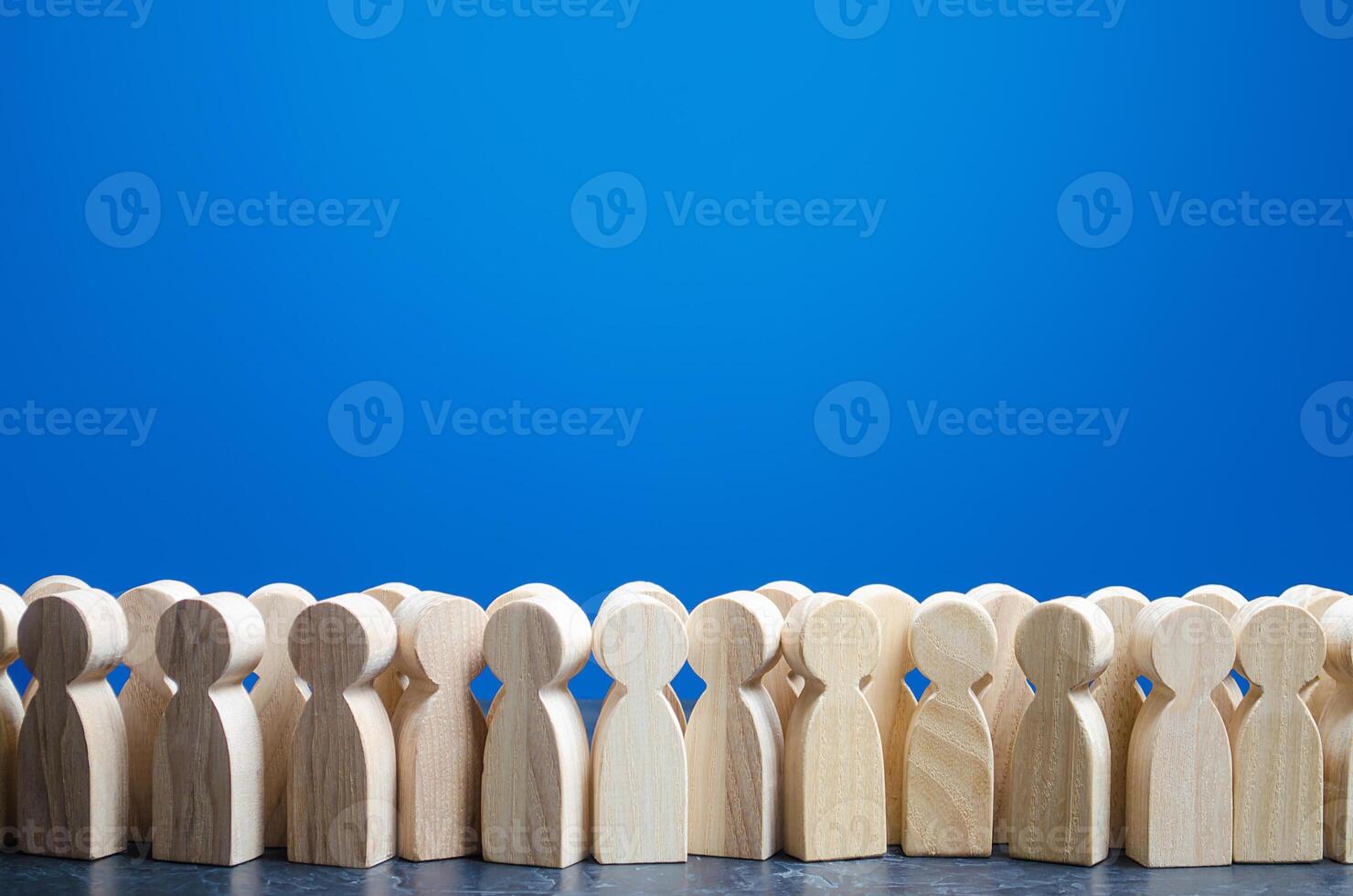 A crowd of wooden figures of people. Customers and buyers, statistics, preferences of Population. group of citizens, rally, political movement or electorate. Society, demography. Employees. Copy space photo