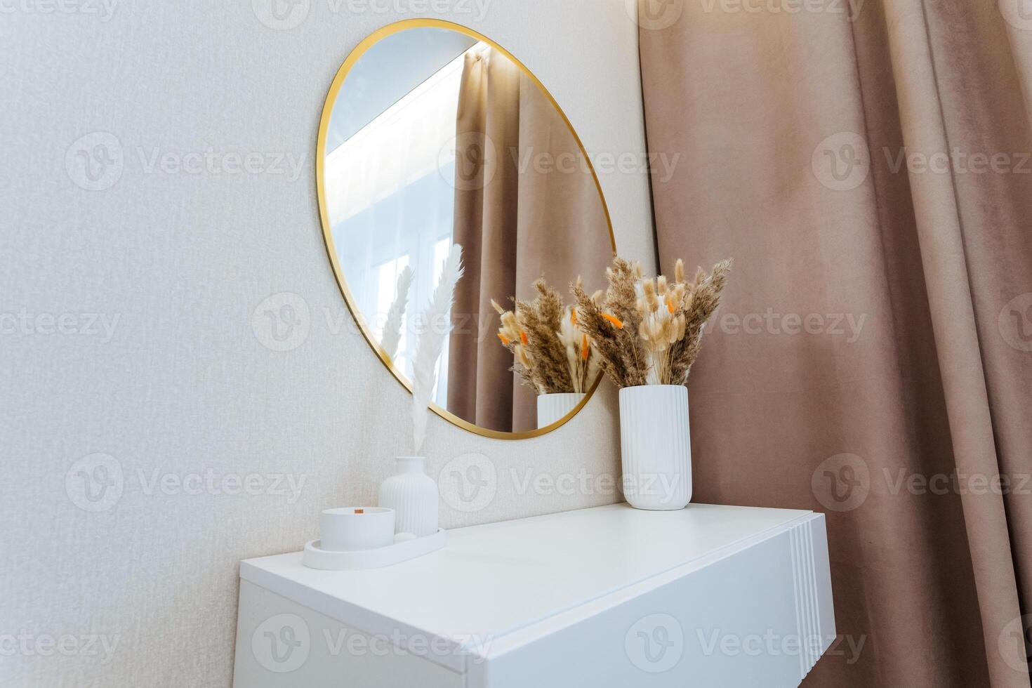 Imagine a beautiful dressing table with a large mirror above it, complemented by exquisitely crafted vases filled with vibrant flowers, enhancing the rooms aesthetic appeal photo