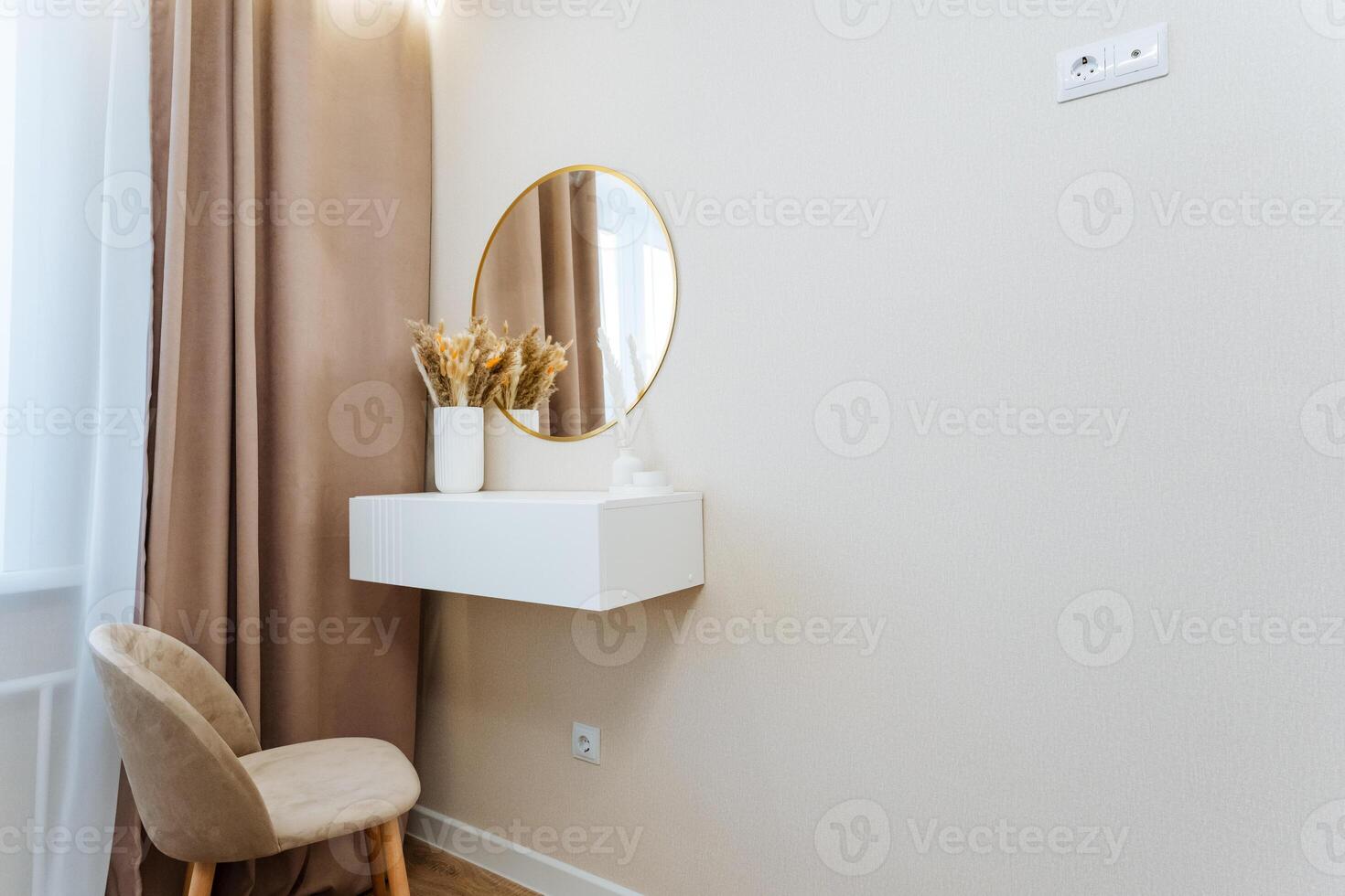 In the room, there is a chair positioned neatly along with a mirror that reflects the surrounding space, adding depth to the interior design and enhancing the overall ambiance photo