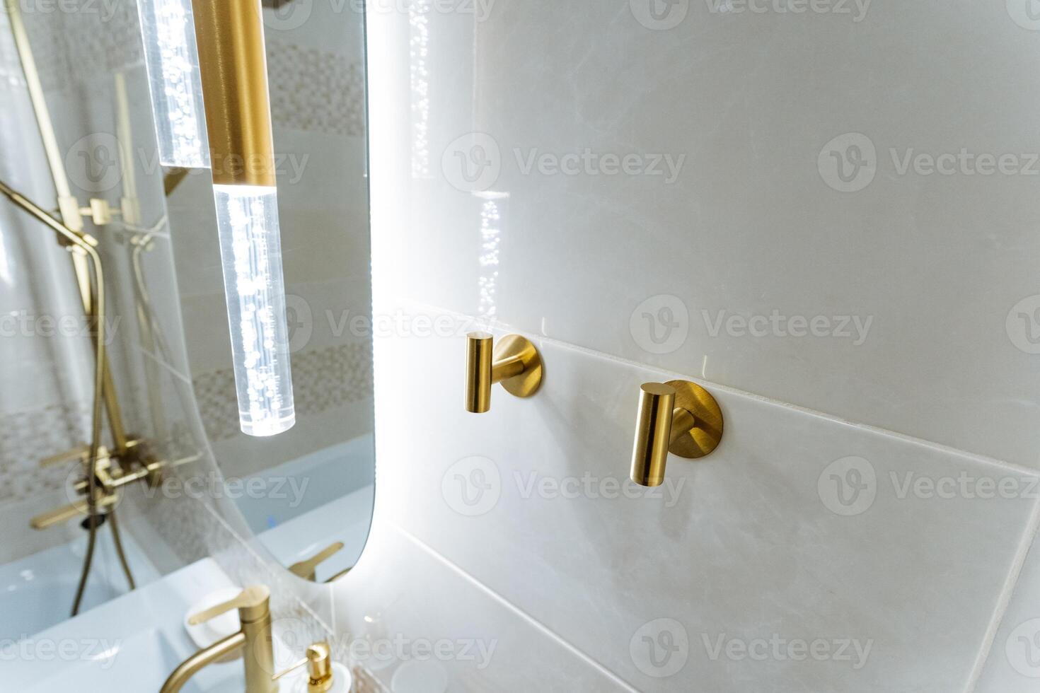 The bathroom is equipped with essential amenities that include a sink, a shower, and a mirror, creating a comfortable and highly functional space for all kinds of daily hygiene routines photo