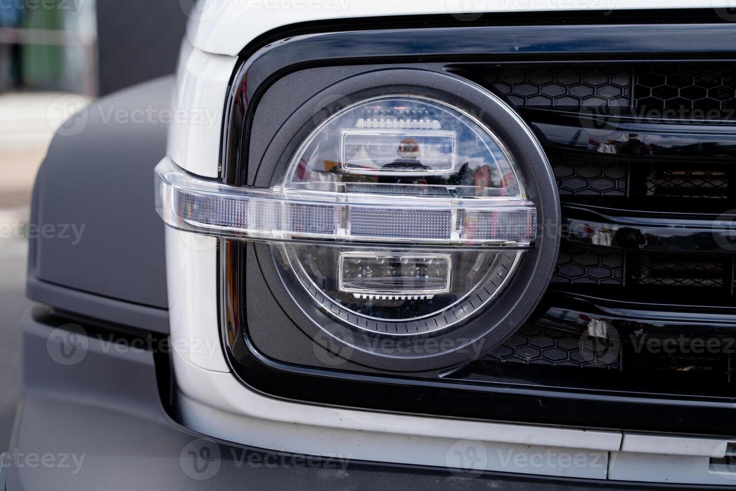 Detailed CloseUp View of the Modern Vehicle Headlight and Grille Design, Showcasing Its Innovative Features photo