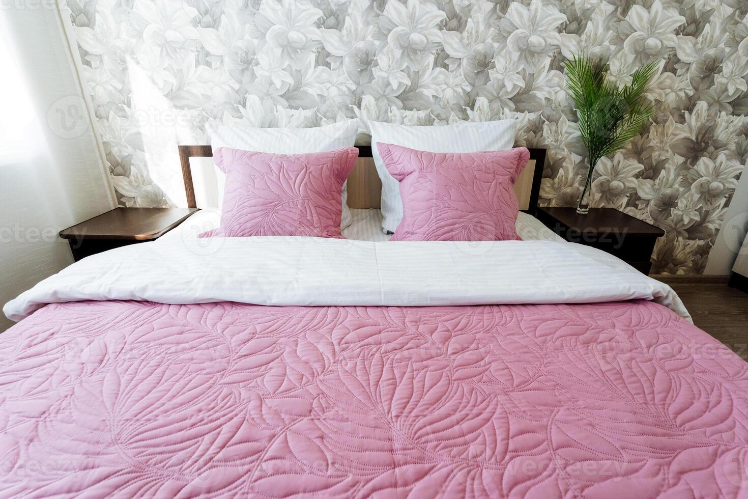 A furniture fixture with pink textile in a buildings bedroom interior design photo