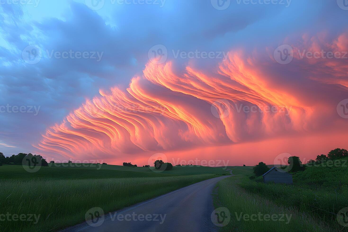 Dramatic Sunset with Surreal Cloud Formations Over a Rural Landscape photo