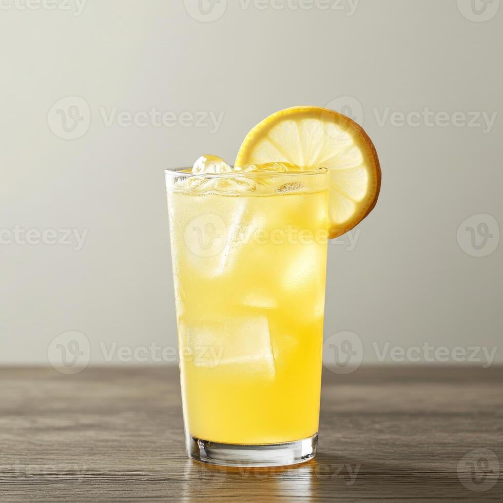 A glass of lemonade with a slice of lemon on top. photo