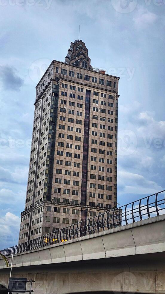 a large building with a bridge over it photo