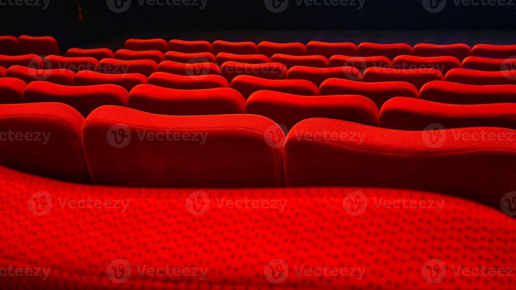 Red cinema auditorium seats with backlight and copy space for text photo