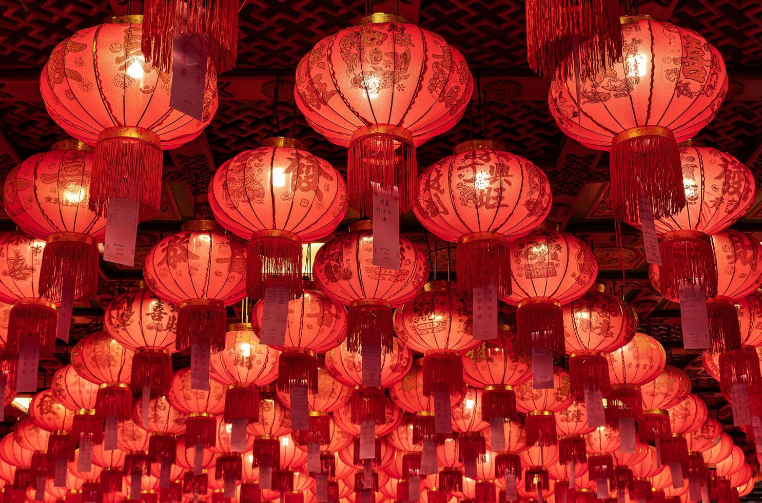 Many red chinese paper lanterns pattern on the ceiling photo