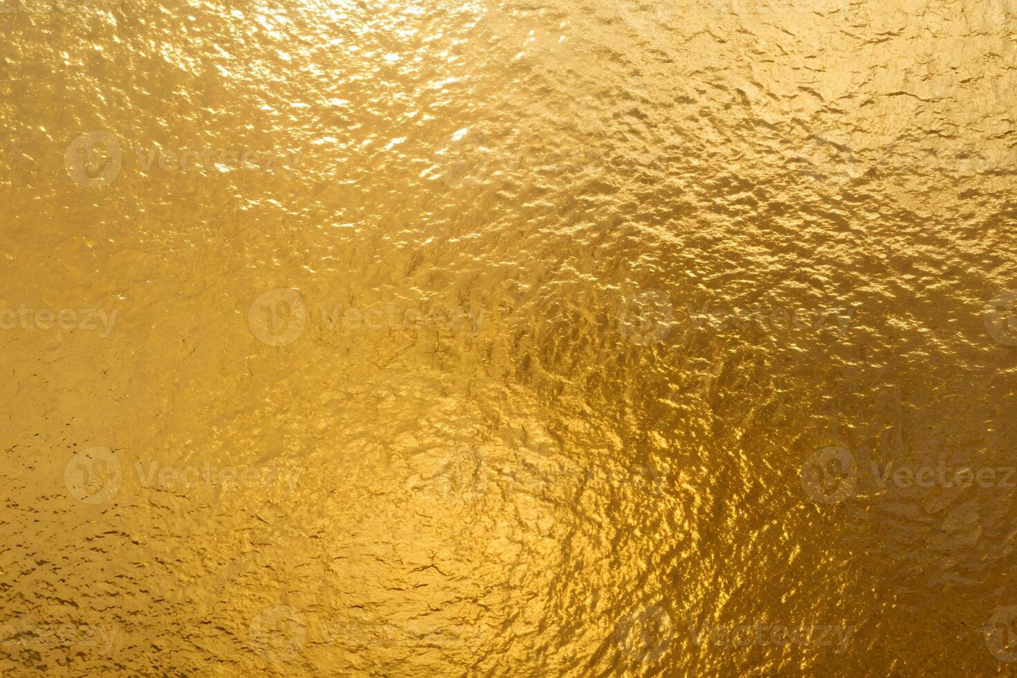 Shiny Golden Foil Glass Texture Background photo