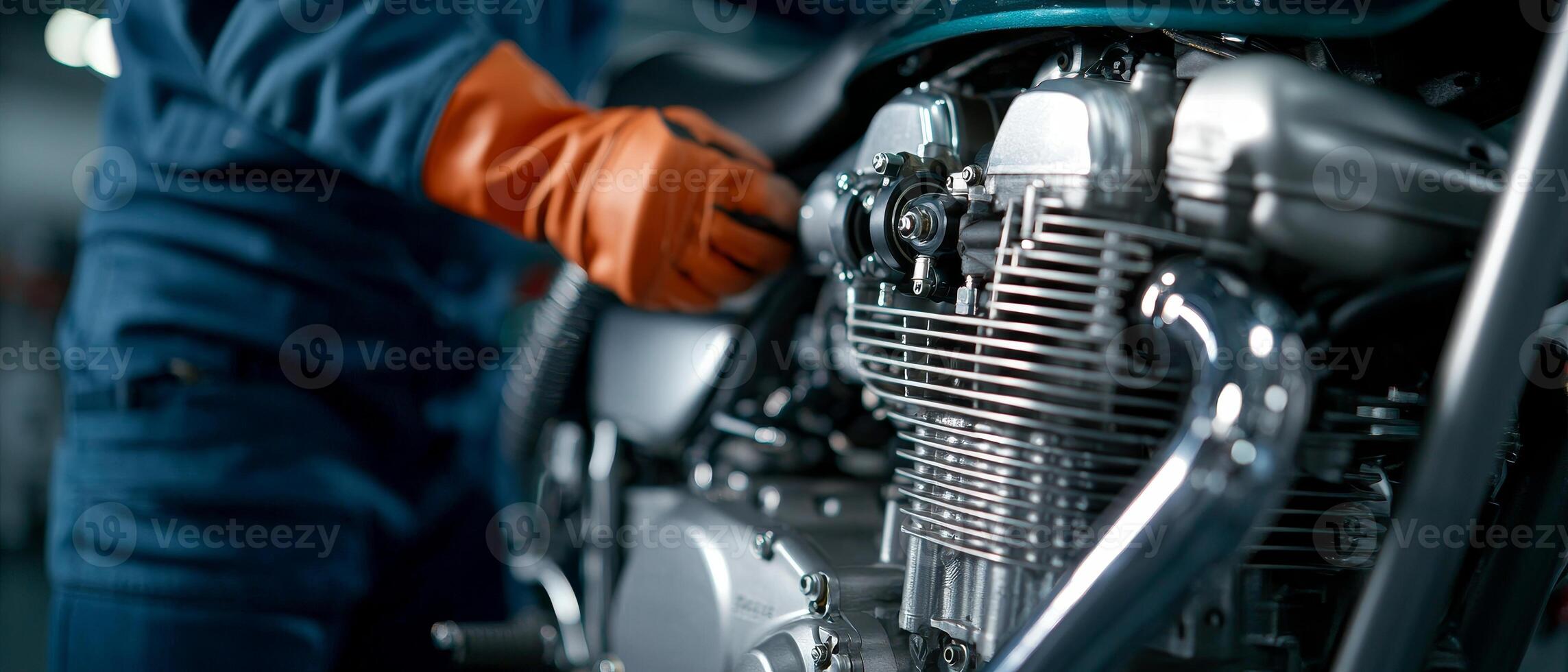 Mechanics repair engine adjustment. Mechanic working on a motorcycle engine in a workshop. photo