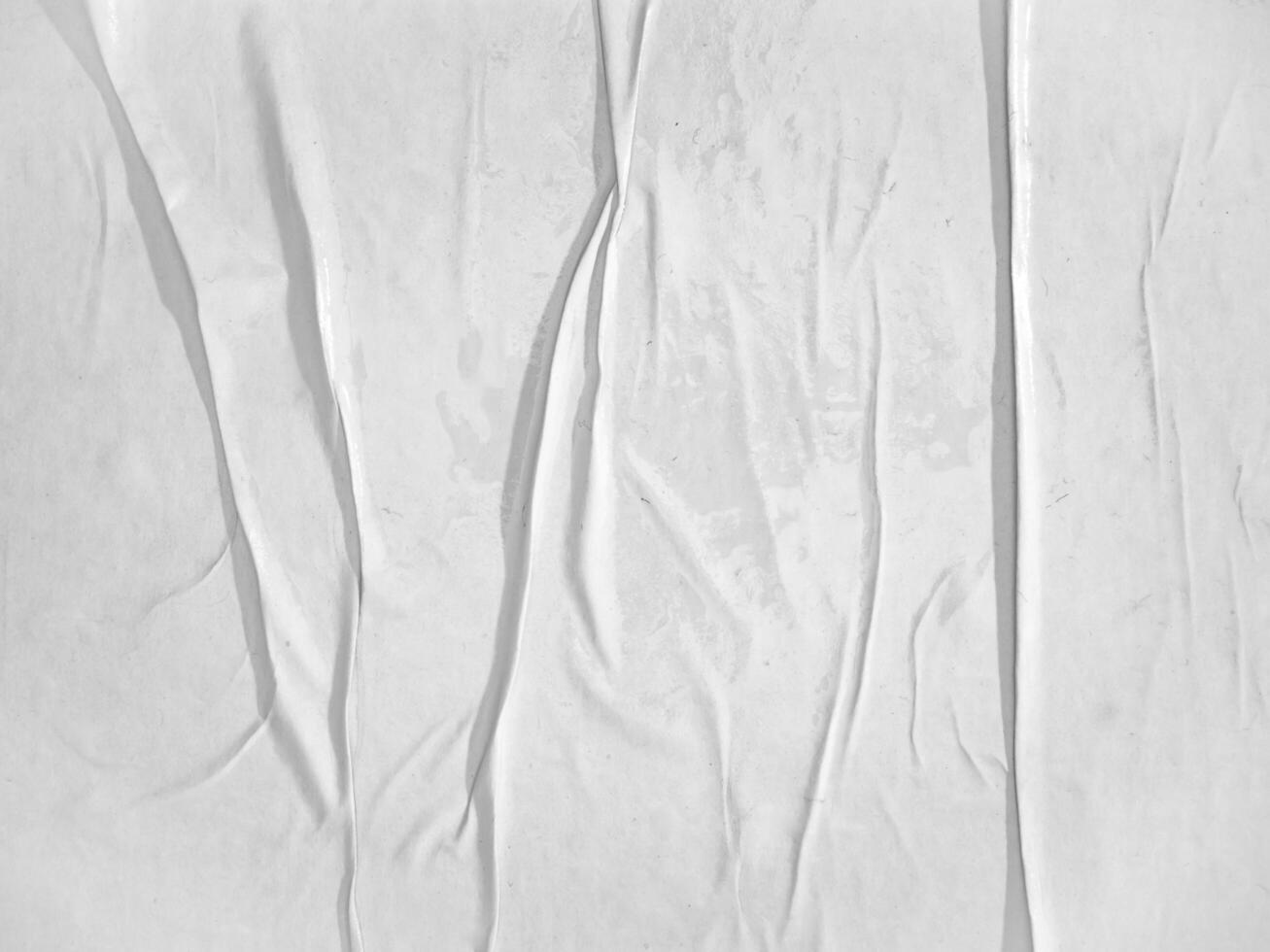 Blank white paper poster texture glued on the wall photo