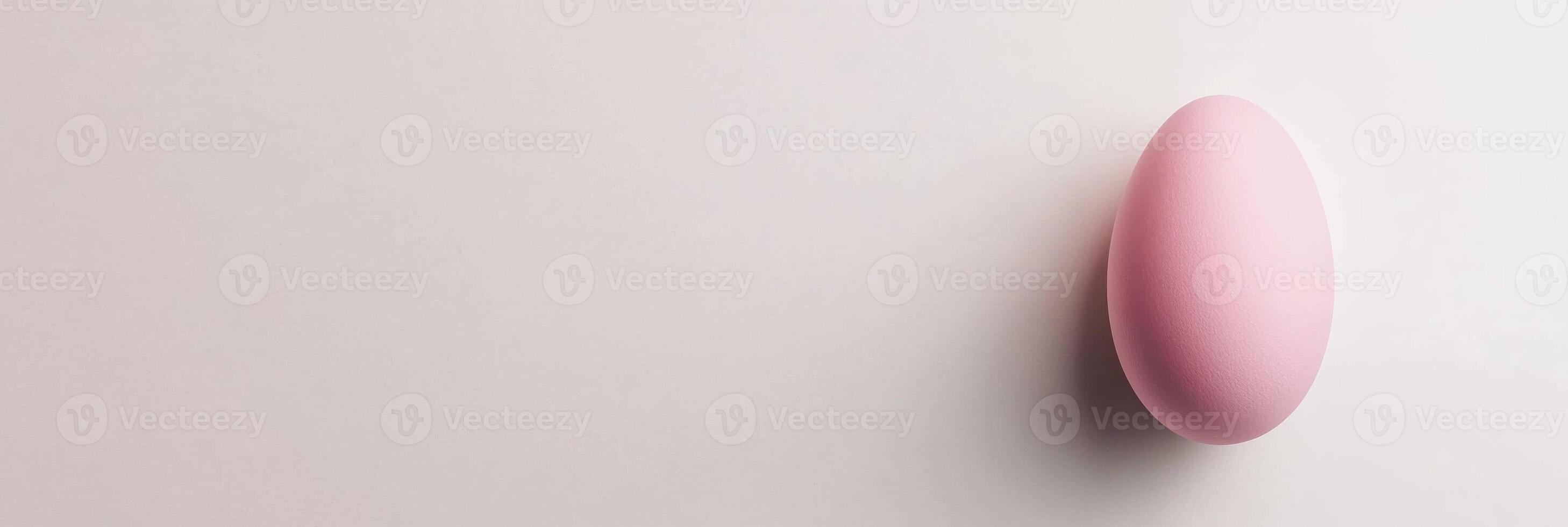 Minimalist pink sphere on a light background displaying simple geometric form photo