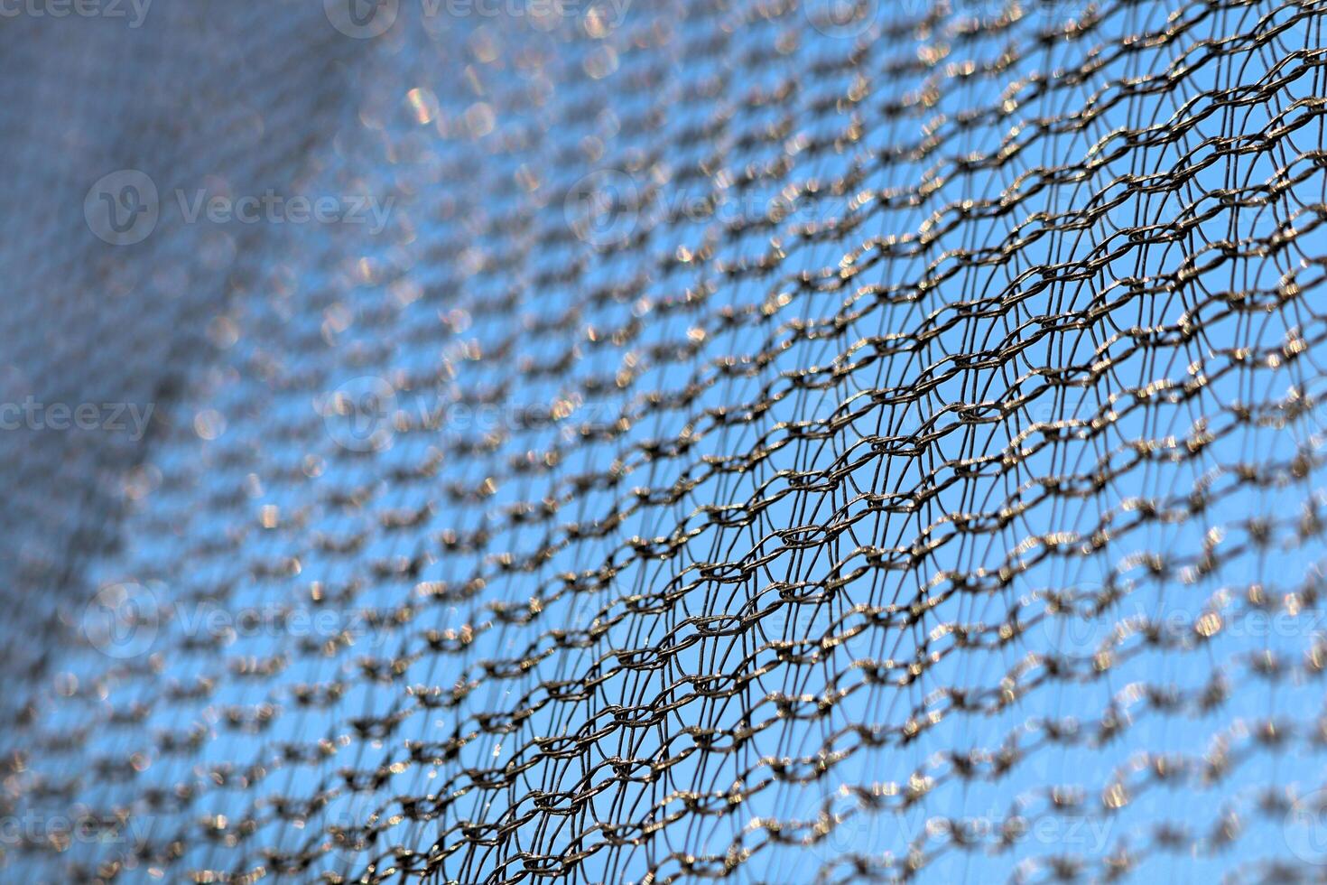 Protective mesh of the walls from a children's trampoline made of fabric durable synthetic mesh photo