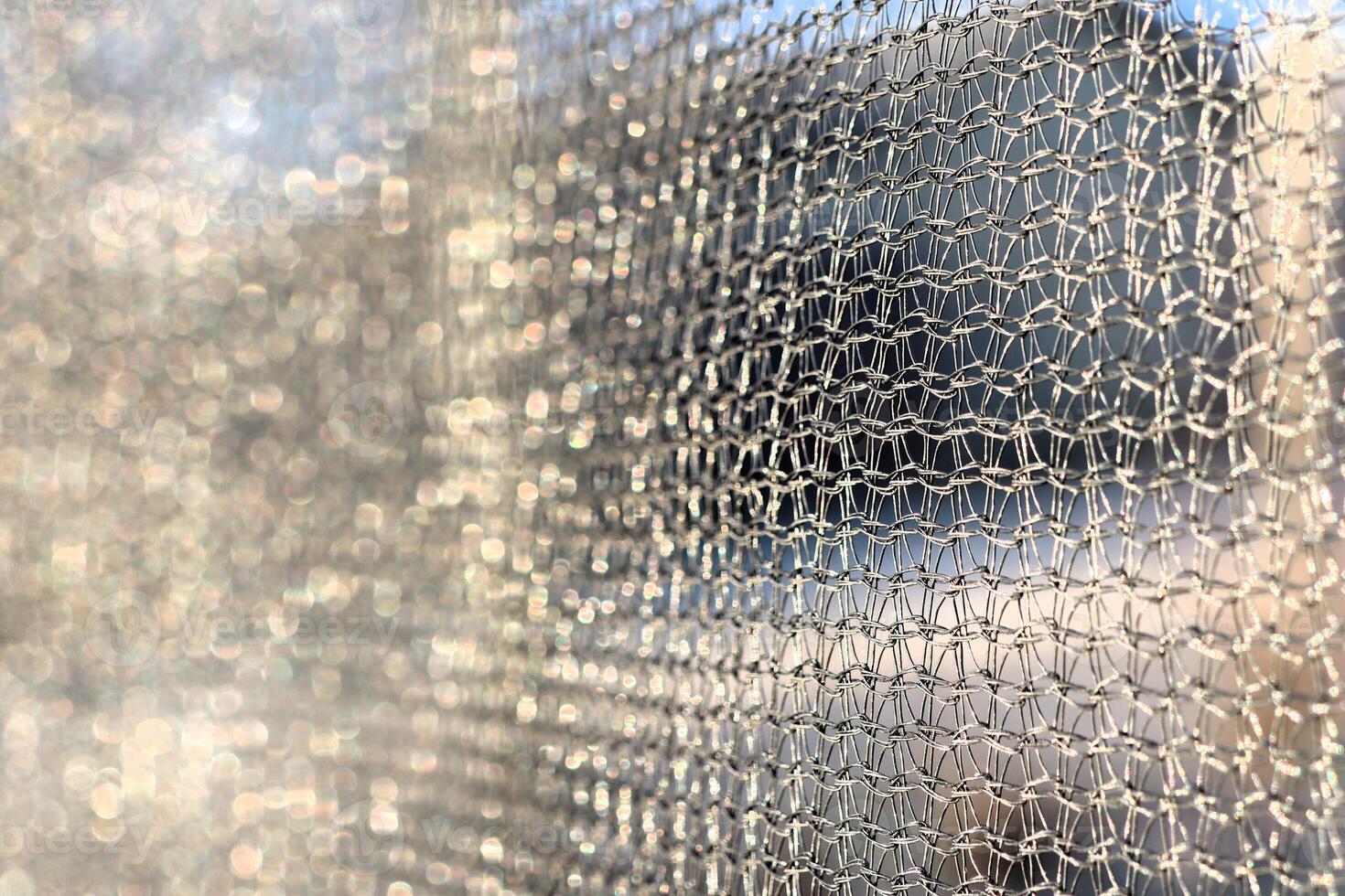 Protective mesh of the walls from a children's trampoline made of fabric durable synthetic mesh photo