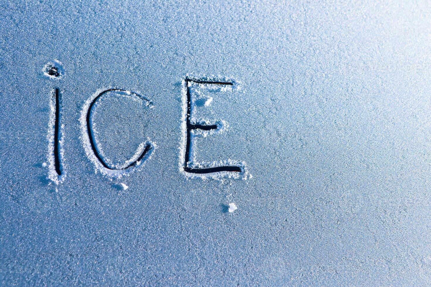Frosty Surface Featuring Ice Letters An Artistic and Detailed Closeup Capture photo