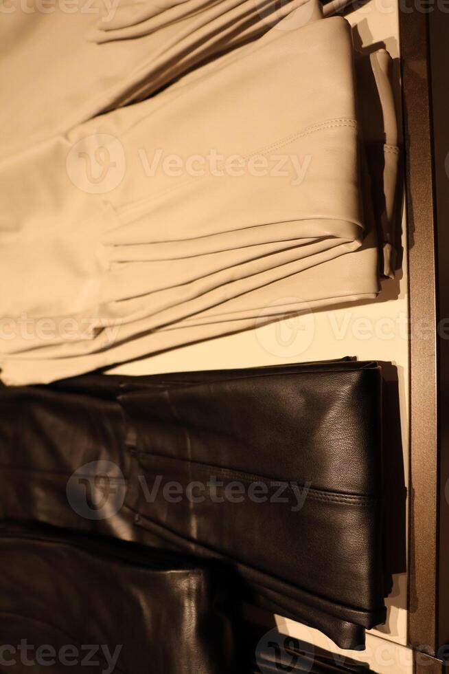 A Display of Fashionable Trousers Set in an Elegant and Stylish Retail Environment photo