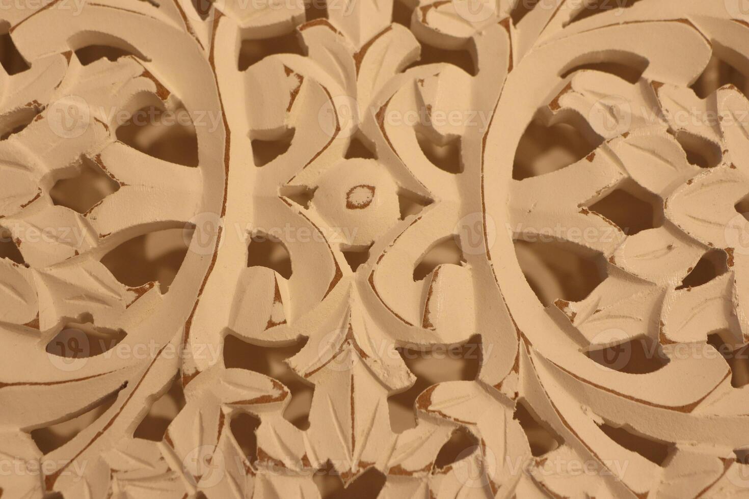 An Intricate and Beautiful Wood Carving Design Featuring a Detailed Floral Motif photo