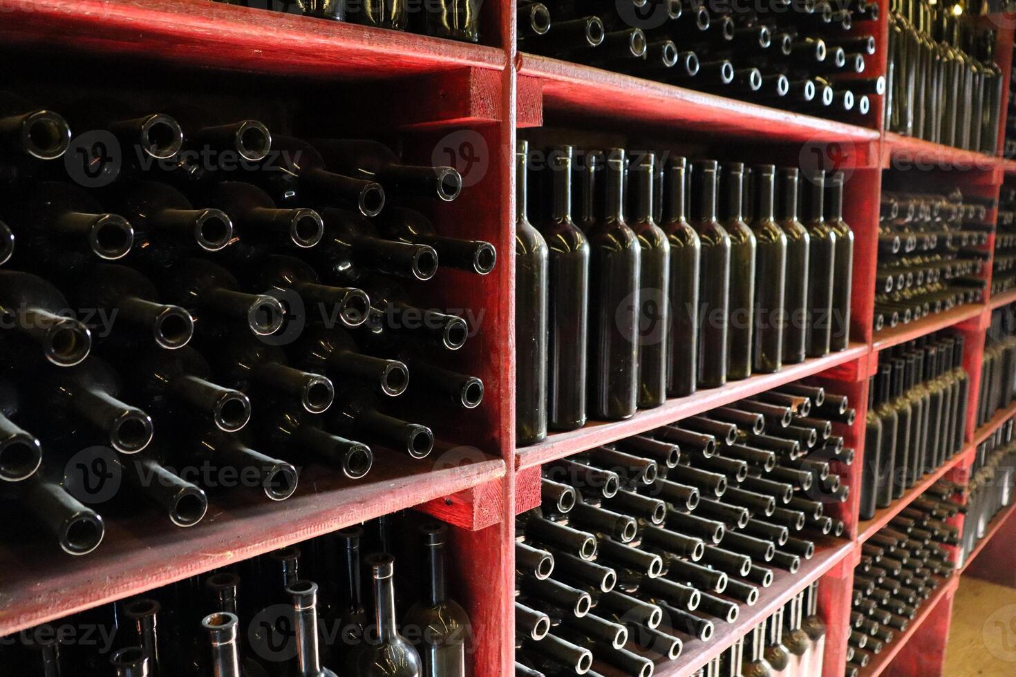 Rows of exquisitely arranged Bottled Wine in a Contemporary and Modern Cellar and Space photo