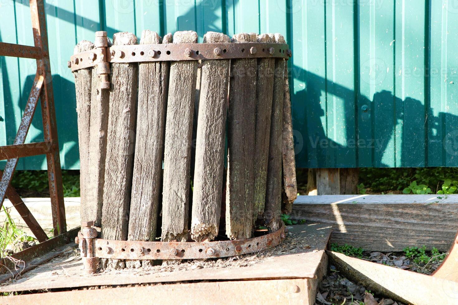 An old wooden cylinder for squeezing grape juice photo