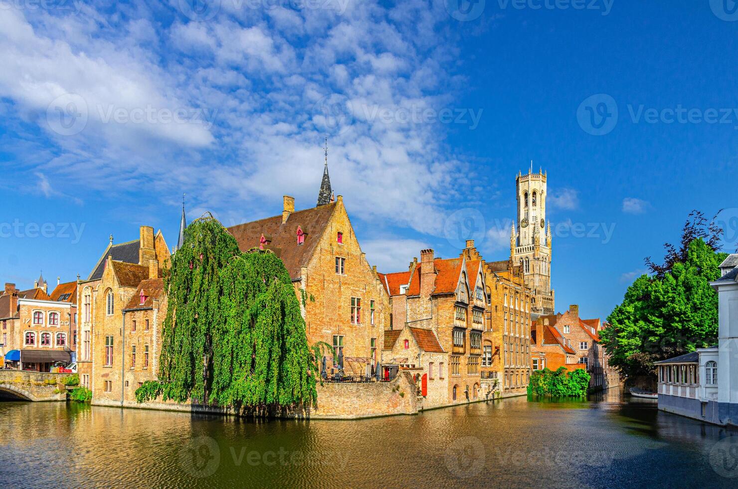 Brugge old town scenic view, Bruges historic city centre, Rosary Quay Rozenhoedkaai embankment with buildings, Belfort Belfry tower, Dijver water canal of Reie river, West Flanders province, Belgium photo