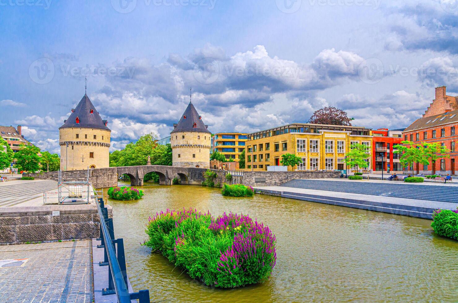 Kortrijk cityscape, embankment of Lys river, Broel Towers stone medieval buildings and Broel Bridge in Kortrijk city centre, belgium landmark, West Flanders province, Flemish Region, Belgium photo