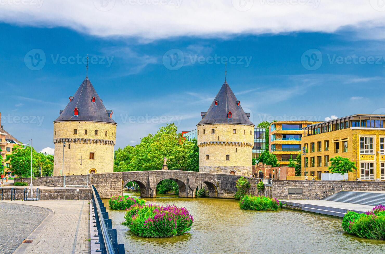 Broeltorens Broel Towers stone medieval buildings and Broel Bridge, embankment of Lys river in Kortrijk city historical centre, Fortification towers, West Flanders province, Flemish Region, Belgium photo