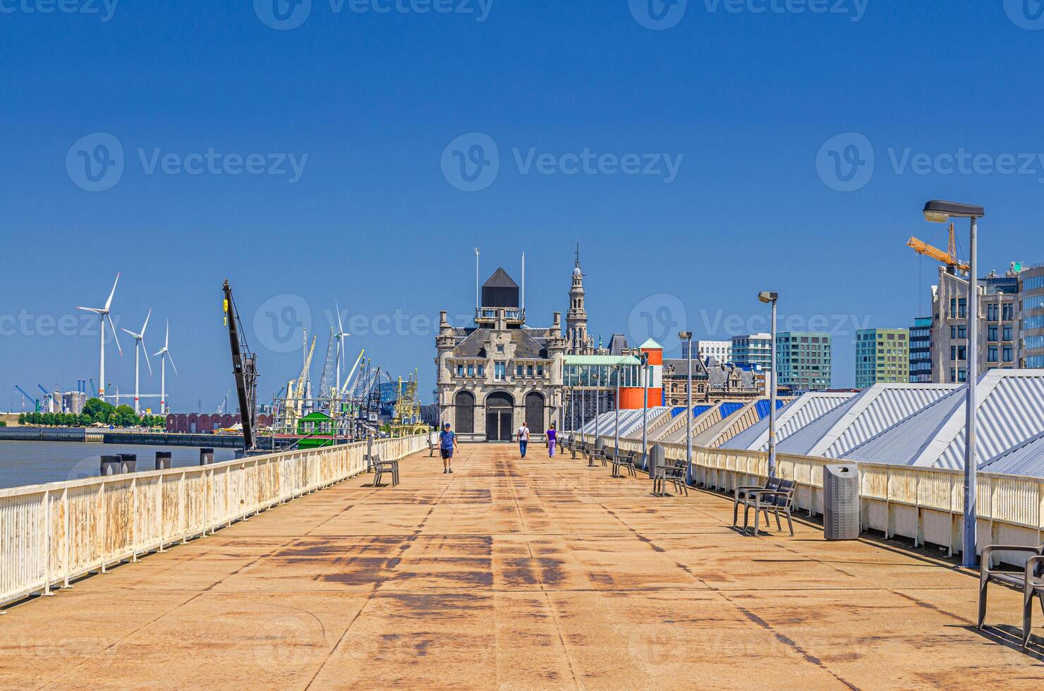 Embankment promenade of Scheldt river on Cruise ponton and Maritiem Park Afdaken, port area in Antwerp city historical centre, Antwerpen old town, Flemish Region photo