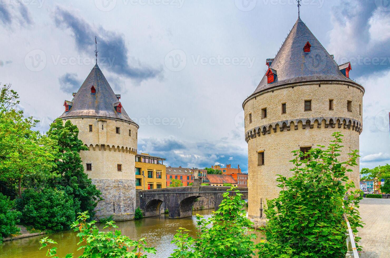 Broeltorens Broel Towers Gothic architecture style stone buildings, Broel Bridge across Lys river in Kortrijk city historical centre, Fortification towers, belgium landmark, Flemish Region, Belgium photo