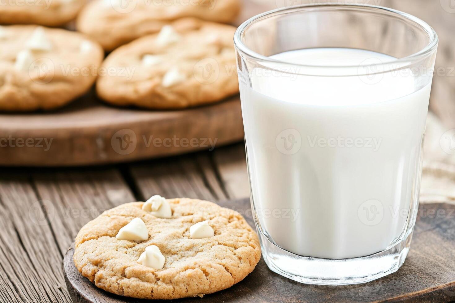 Freshly baked cookies and a glass of milk on a wooden board create a cozy and welcoming atmosphere for delightful moments at home photo