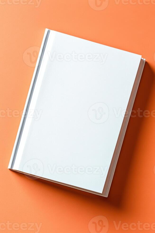 Elegant blank white book cover mockup presented against a peach background showcasing a minimalistic and contemporary design for creative projects photo