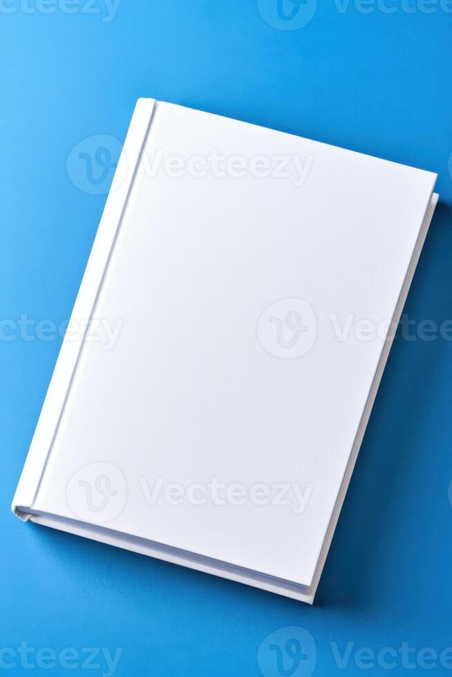 Minimalist mockup of a book with blank cover against a smooth gradient blue background for design purposes photo