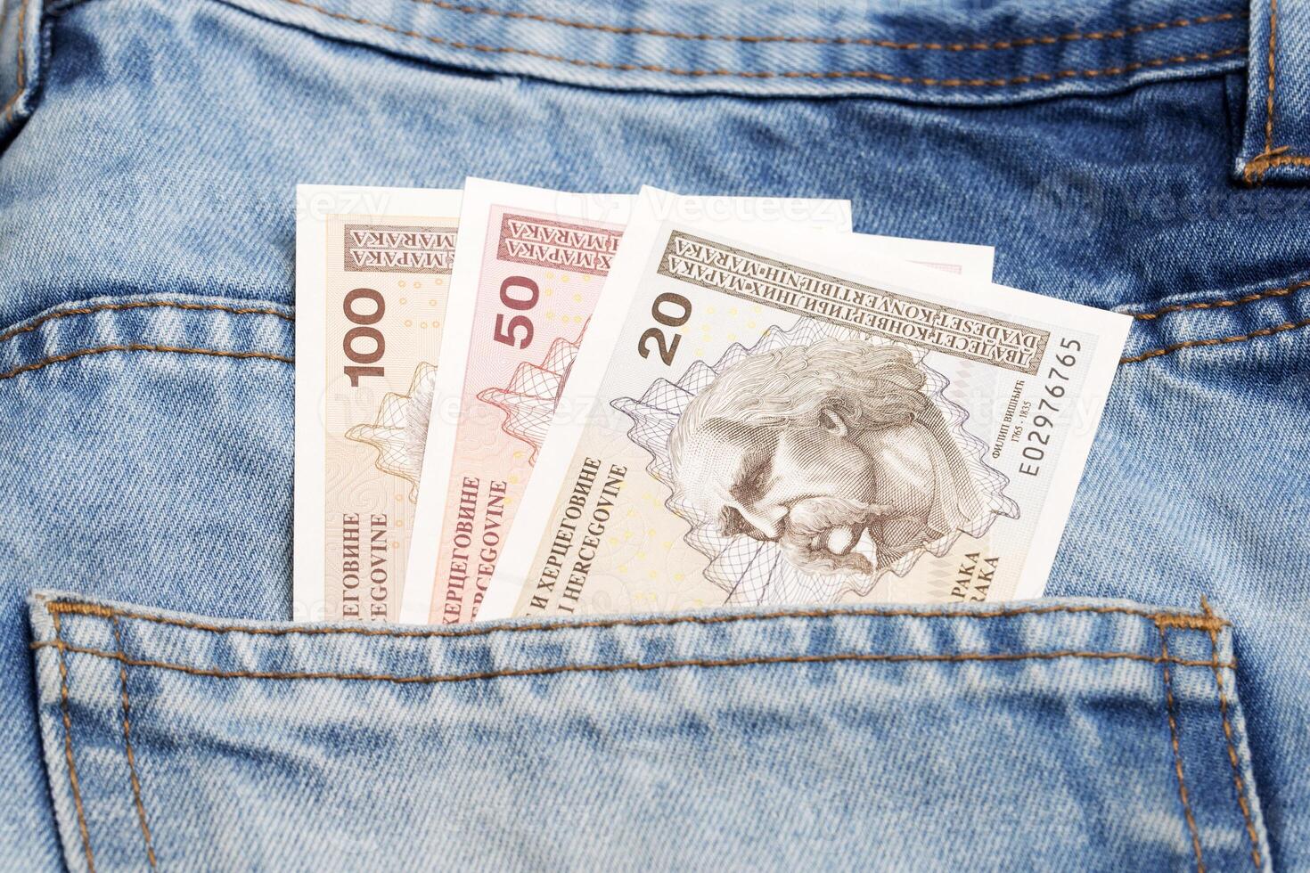 Bosnia and Herzegovina money - convertible mark in the pocket of blue jeans photo