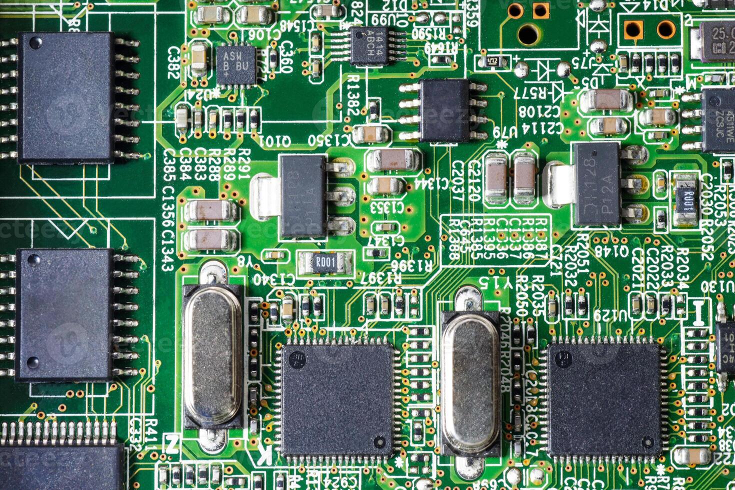 Closeup view of a circuit board of server computer, with microchips and components photo