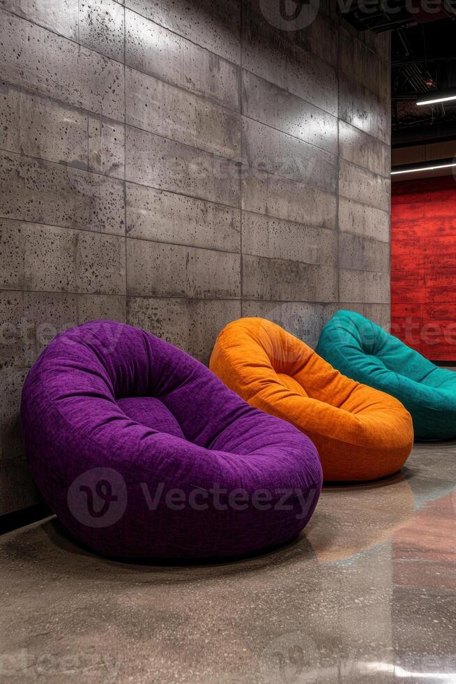 Three colorful beanbag chairs in a modern interior photo
