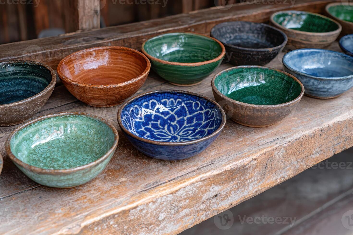 Collection of artisan made ceramic bowls in a variety of colors and patterns photo