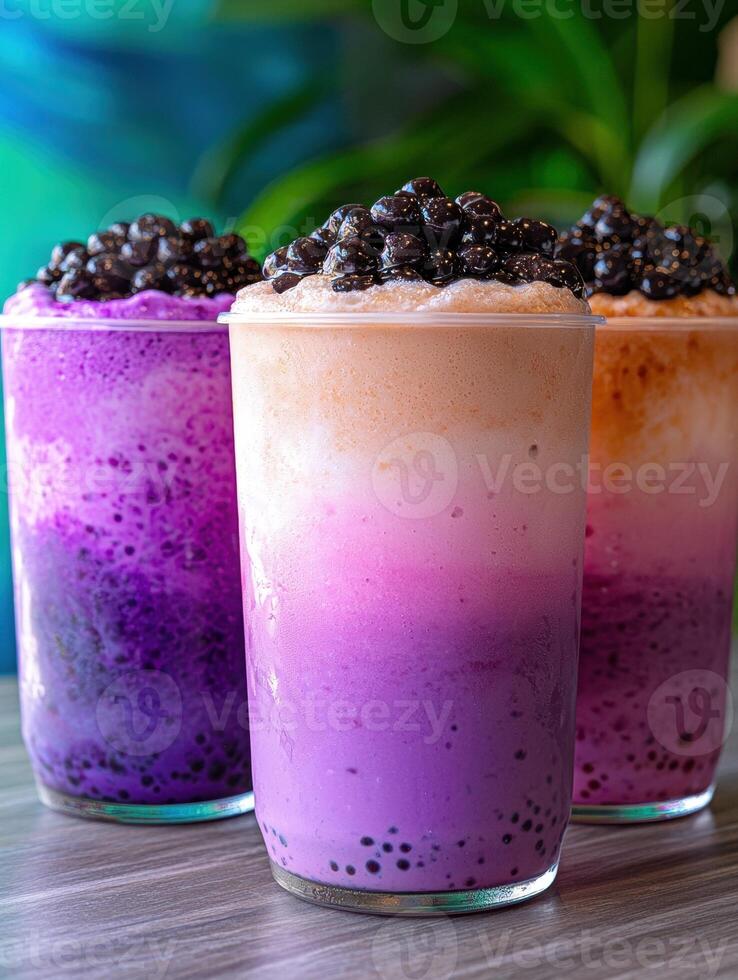 Three layered purple boba drinks with tapioca pearls photo