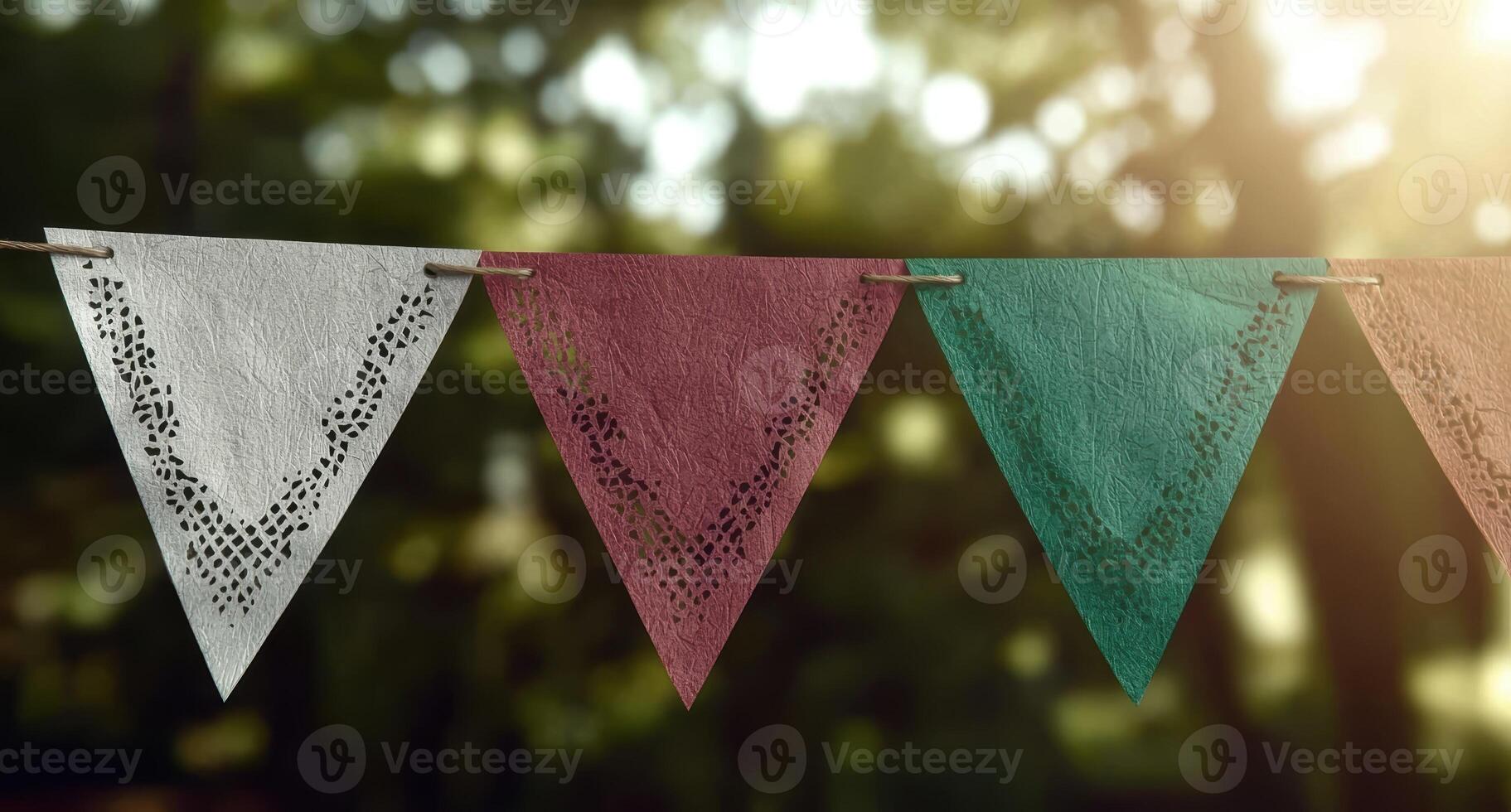 Triangular paper bunting hanging outdoors photo