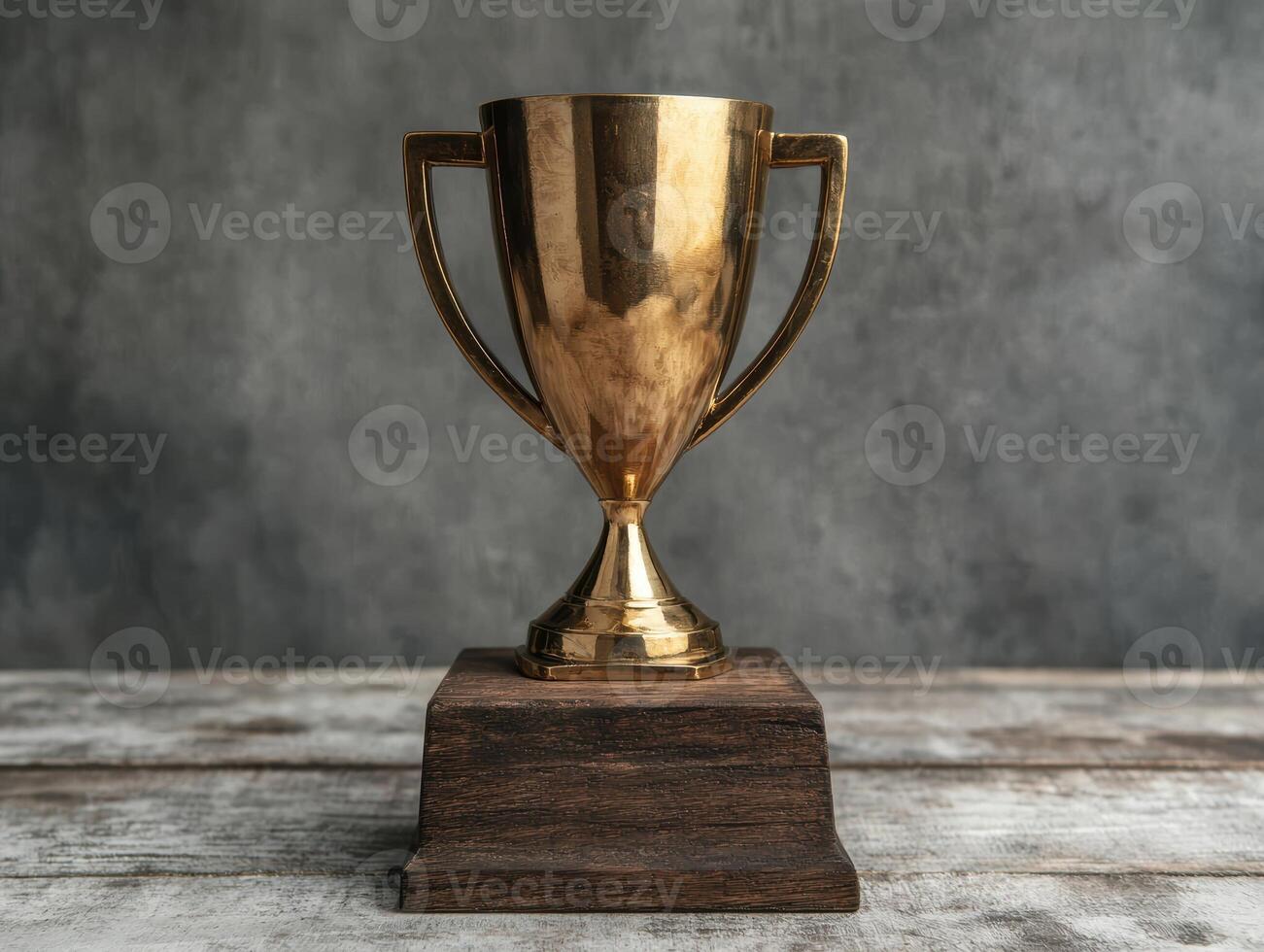 Gold trophy on wooden base photo