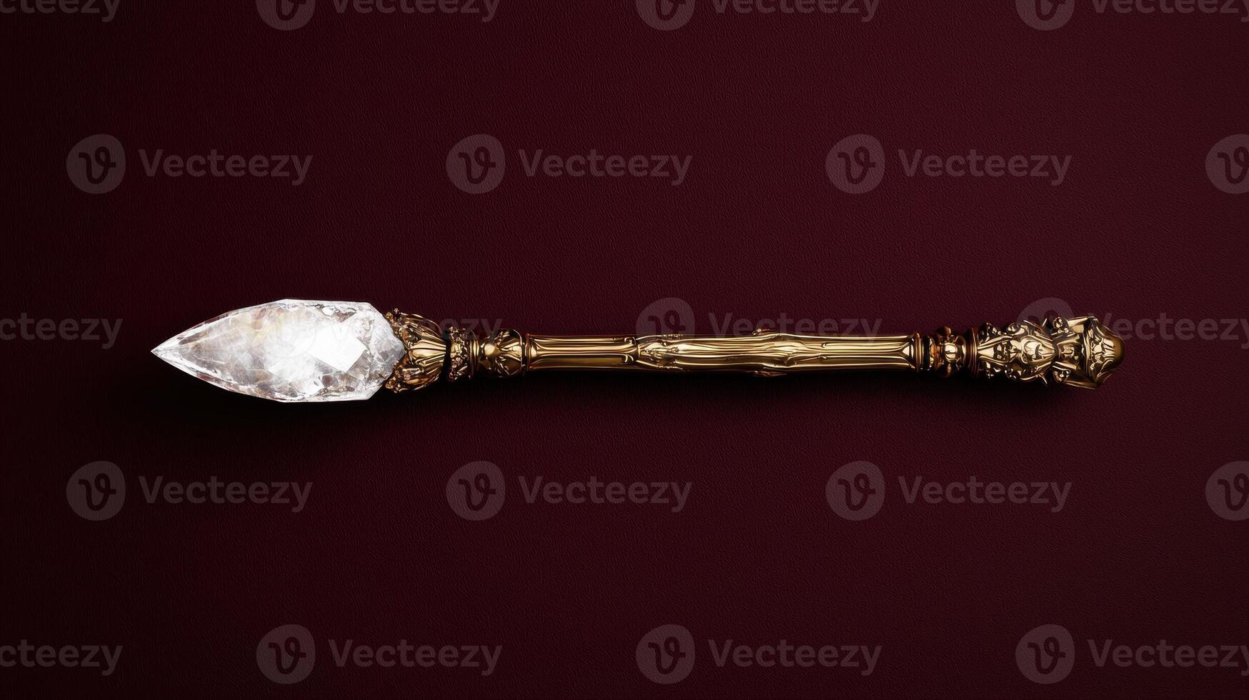 Ornate golden scepter with a clear crystal point photo