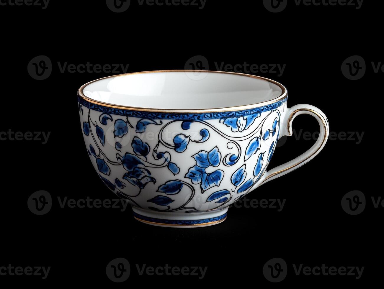 Blue and white floral teacup on black background. photo