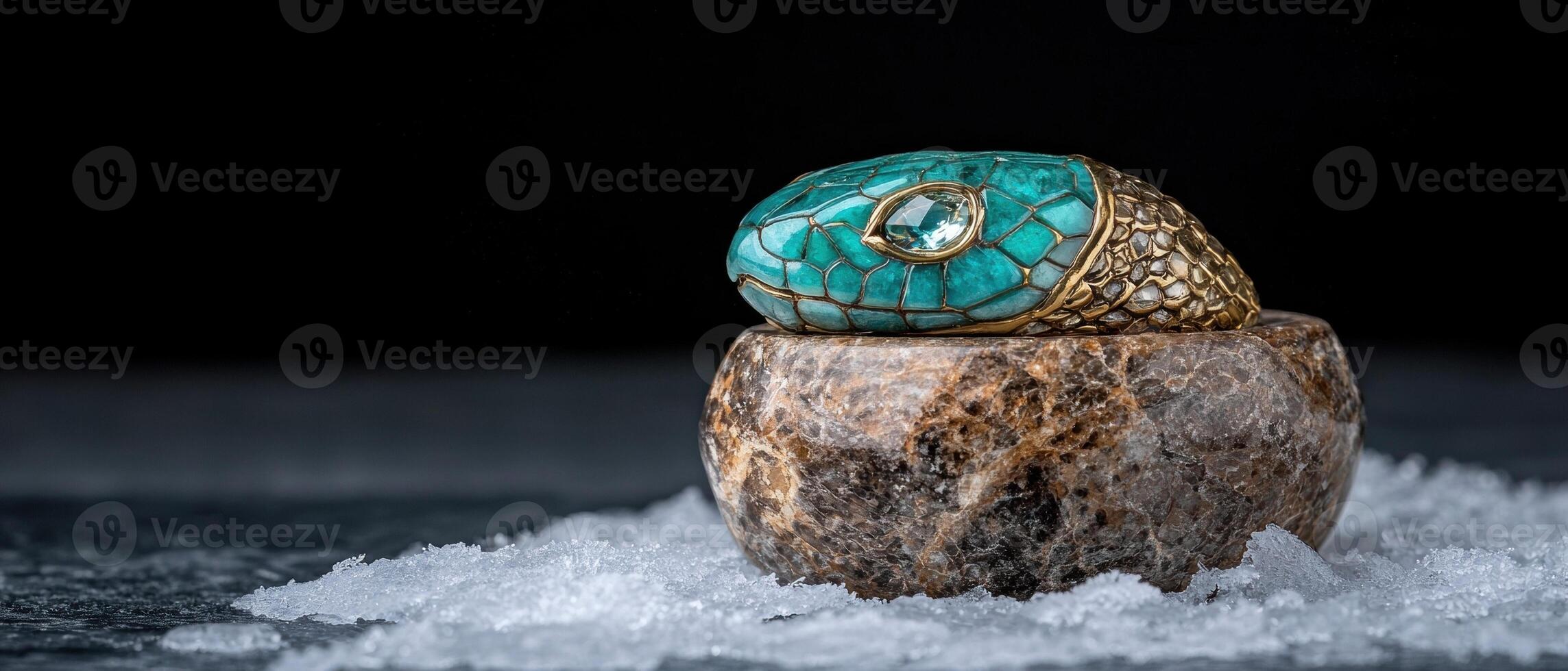 Luxury turquoise snake ring with aquamarine gemstone on marble photo