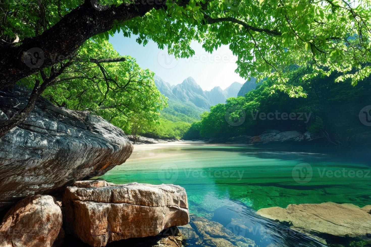 Tranquil river flowing through a lush green valley photo