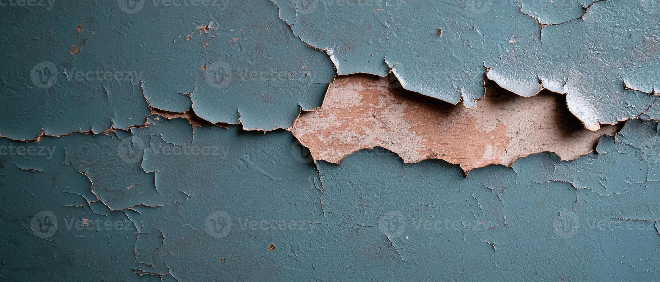Close up of peeling paint on a wall, showing texture and color variations photo