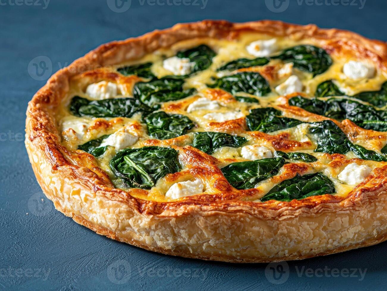Delicious spinach and feta quiche with flaky crust photo